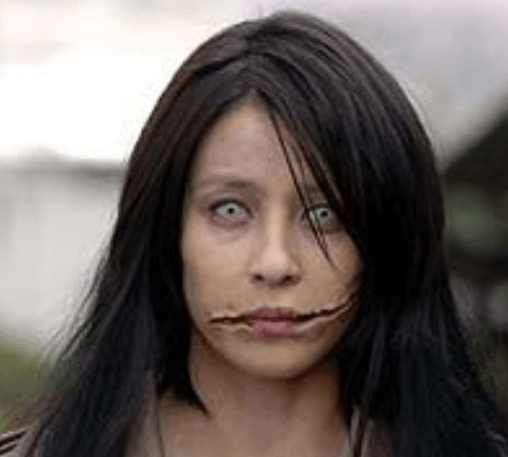 Kuchisake-onna carries an ear to ear slit across her face